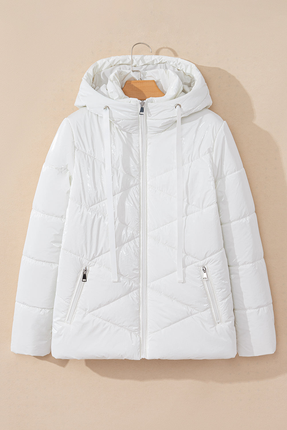 Manteau matelassé blanc à capuche zippé